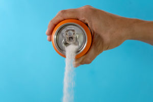 pouring soda from can