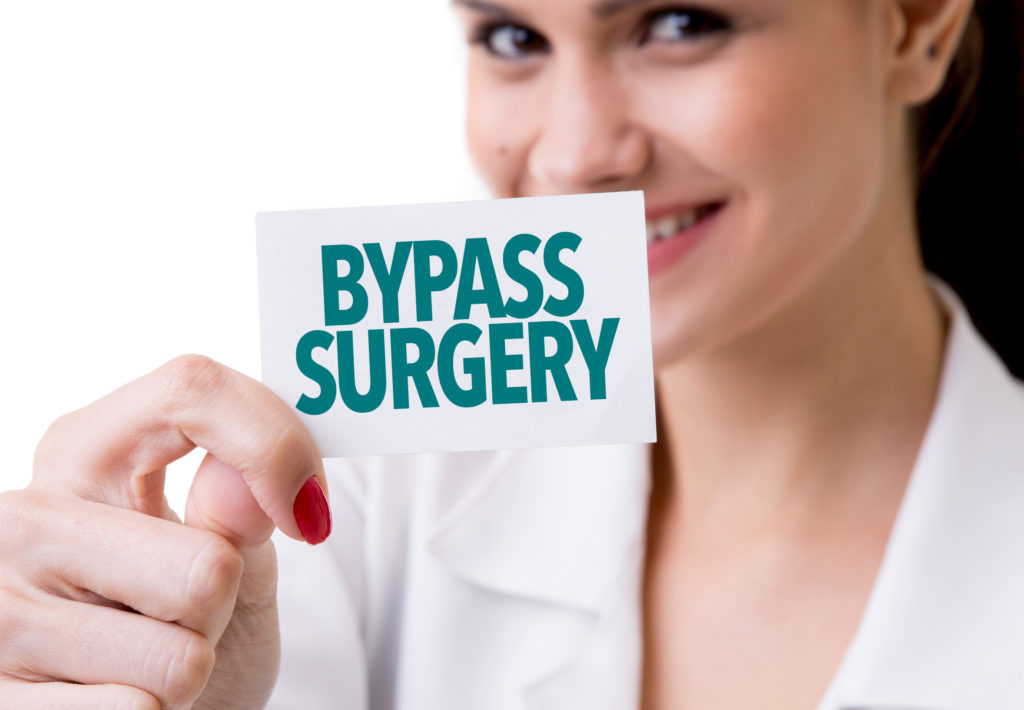 woman holding bypass surgery card